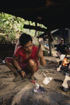 A metal worker hammers out a parang blade in the Long Beku village along the Baram River in Borneo, Malaysia. Edged tools are produced in the village for sale in local and regional markets by Tom Iain White